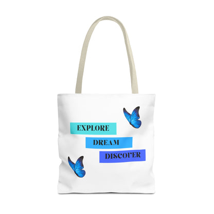 White Explore, Dream, Discover tote bag with beige handles, featuring inspirational words and butterfly designs. Crafted from 100% polyester for durability, this stylish tote is ideal for daily errands and shopping. Available in sizes 13"x13", 16"x16", 18"x18". Luminous Gem Designs.