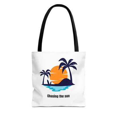 Chasing the Sun tote bag in white with black handles, featuring a tropical palm tree design. This durable 100% polyester tote is perfect for summer adventures, beach trips, or grocery runs. Available in sizes 13"x13", 16"x16", 18"x18". Luminous Gem Designs.