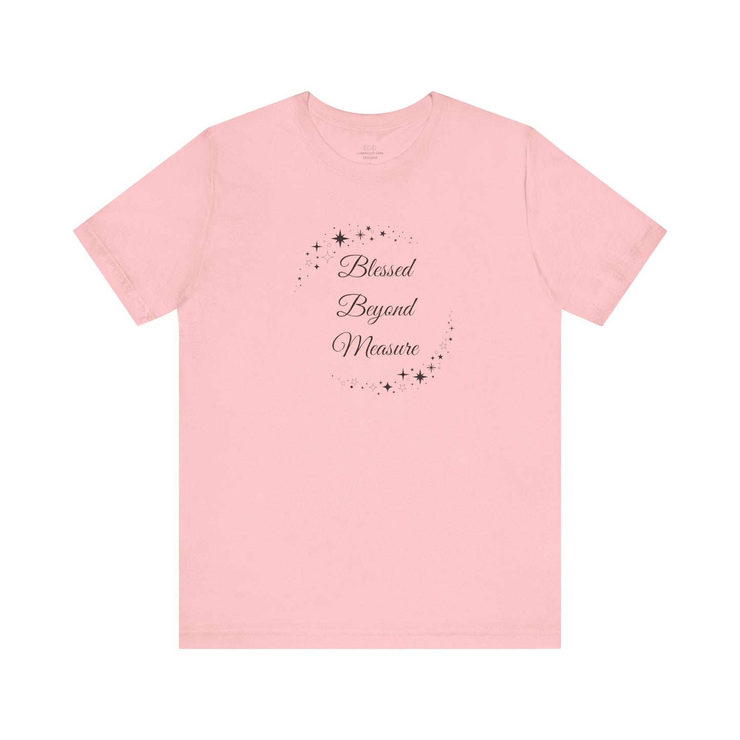 Charming pink "Blessed Beyond Measure" T-shirt adorned with celestial star patterns. Soft, stylish, and great for casual outings or gifting. Sizes: XS, S, M, L, XL, 2XL, 3XL. Luminous Gem Designs.