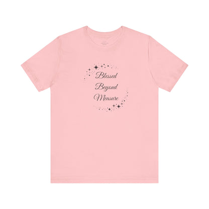 Charming pink "Blessed Beyond Measure" T-shirt adorned with celestial star patterns. Soft, stylish, and great for casual outings or gifting. Sizes: XS, S, M, L, XL, 2XL, 3XL. Luminous Gem Designs.