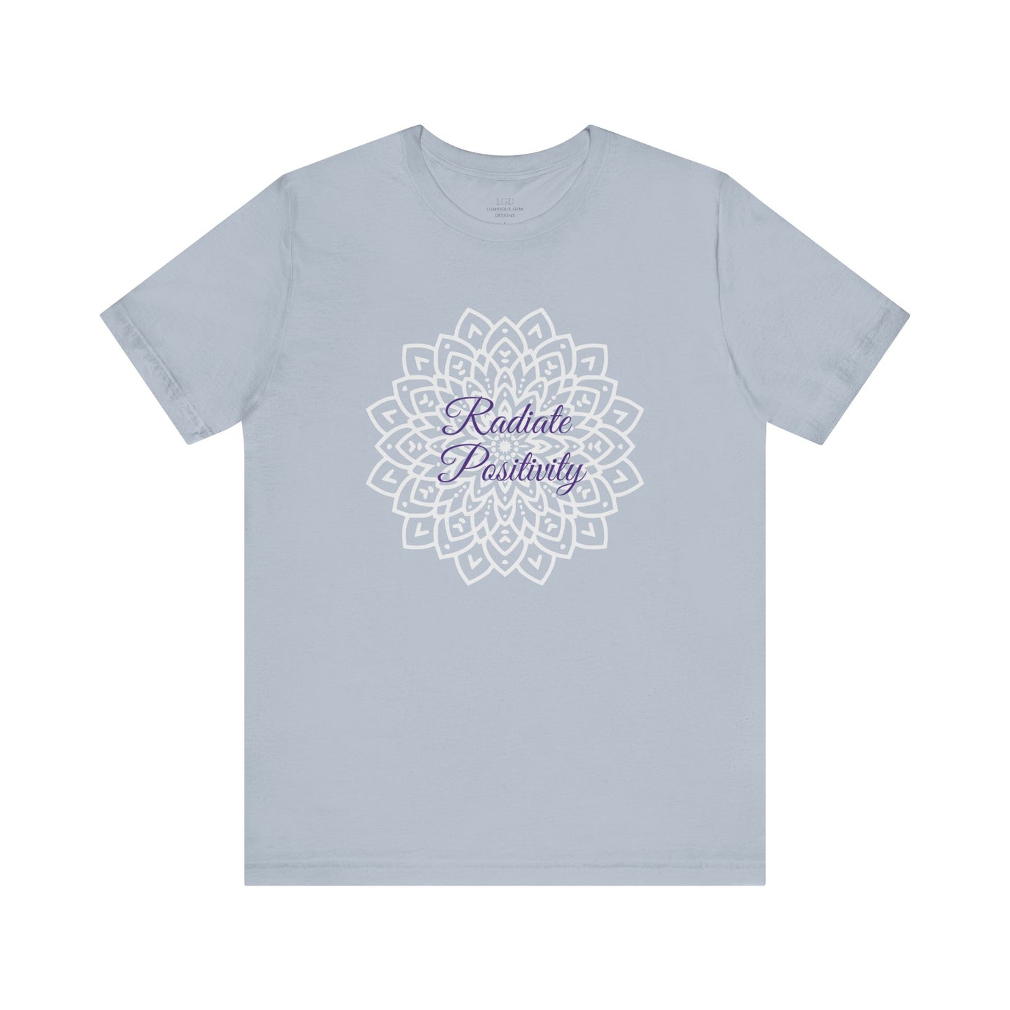 Light blue "Radiate Positivity" T-shirt with a detailed mandala design. Soft, breathable, and stylish for daily wear, yoga, and mindfulness lovers. Sizes: XS, S, M, L, XL, 2XL, 3XL. Luminous Gem Designs.