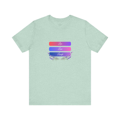 Unique heather prism mint "Live Love Laugh" T-shirt with an inspiring design and soft cotton feel. Breathable, comfy, and ideal for everyday positivity. Sizes: XS, S, M, L, XL, 2XL, 3XL. Luminous Gem Designs