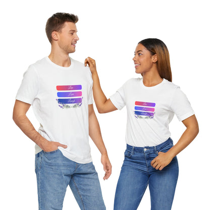 A man and a woman wearing a unisex white "Live Love Laugh" T-shirt featuring an inspiring quote and delicate floral design. Soft, breathable, and perfect for casual and layered outfits. Sizes: XS, S, M, L, XL, 2XL, 3XL. Luminous Gem Designs