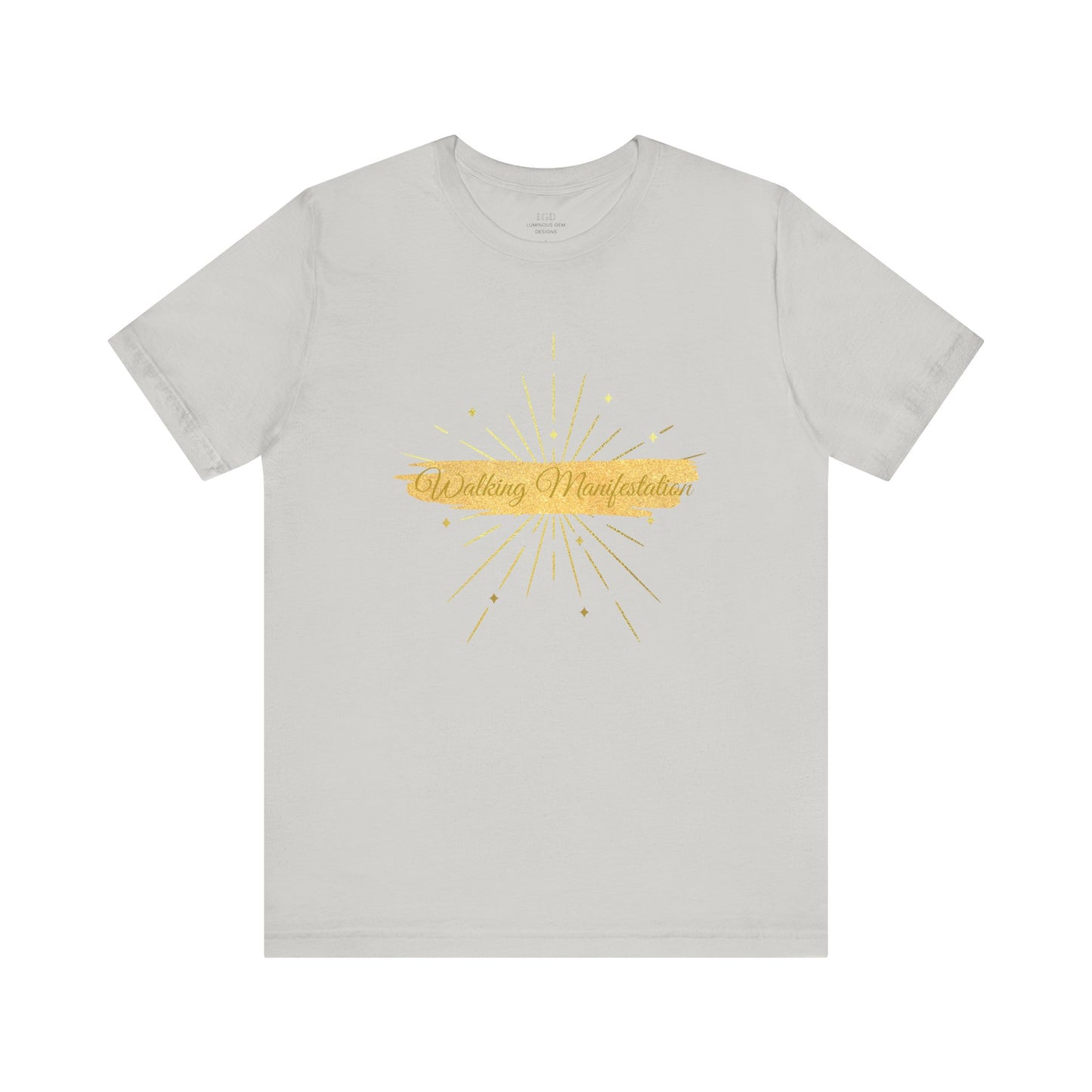 Elegant silver "Walking Manifestation" T-shirt with a striking gold design. A must-have for those who radiate self-confidence and positivity. Sizes: XS, S, M, L, XL, 2XL, 3XL. Luminous Gem Designs.