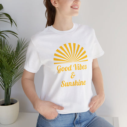 Woman wearing Crisp white Good Vibes and Sunshine Unisex T-shirt, featuring a cheerful sunshine design and Good Vibes quote. Made from breathable 100% Airlume combed and ring-spun cotton, ideal for casual summer styling. Sizes: XS, S, M, L, XL, 2XL, 3XL. Luminous Gem Designs