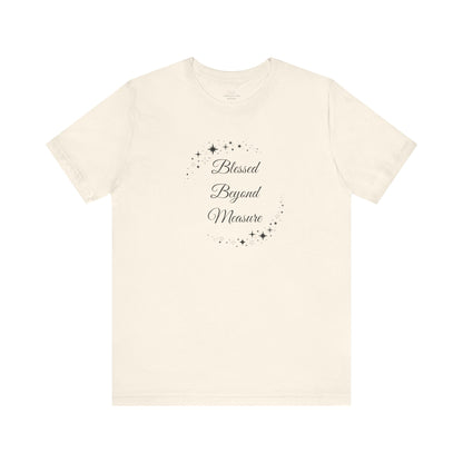 Minimalist natural "Blessed Beyond Measure" T-shirt with delicate star prints, ideal for everyday inspiration. Lightweight and stylish for casual or semi-formal wear. Sizes: XS, S, M, L, XL, 2XL, 3XL. Luminous Gem Designs.