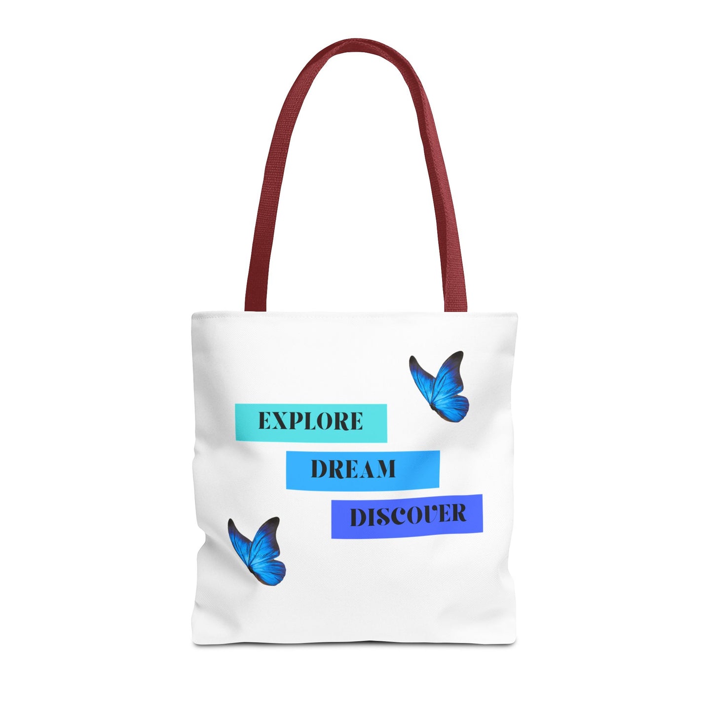 Stylish white Explore, Dream, Discover tote bag with red handles, featuring a motivational design with butterflies. This 100% polyester tote is ideal for daily use, shopping, or as an eco-friendly option. Available in sizes 13"x13", 16"x16", 18"x18". Luminous Gem Designs.