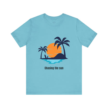 Eye-catching turquoise "Chasing the Sun" T-shirt, great for summer lovers and travelers. Comfy, soft, and lightweight for all-day wear. Available in XS, S, M, L, XL, 2XL, 3XL. Luminous Gem Designs